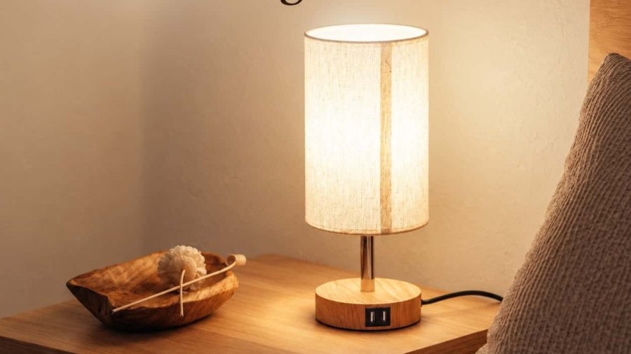 Best bedside lamps for small nightstands: slim lamp on a compact white bedside table