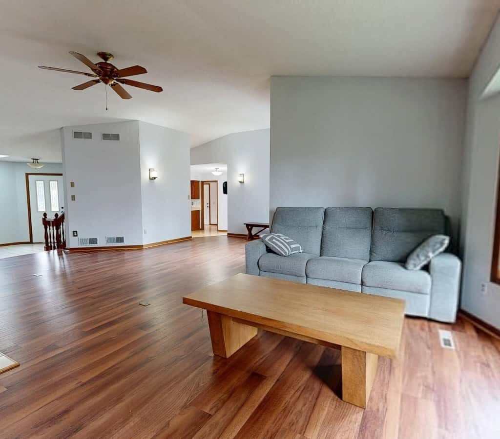 Clean hardwood floor in a modern living room after vacuuming